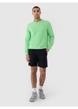Męskie spodenki dresowe 4F 4FRSS25TSHOM698 - czarne ze sklepu Sportstylestory.com w kategorii Spodenki męskie - zdjęcie 184610835