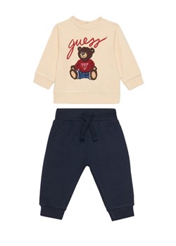 Guess Dres H5YI00 KAX74 Beżowy Regular Fit ze sklepu MODIVO w kategorii Komplety niemowlęce - zdjęcie 184615098