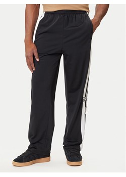 adidas Spodnie dresowe Adibreak JP3760 Czarny Regular Fit ze sklepu MODIVO w kategorii Spodnie męskie - zdjęcie 184657295
