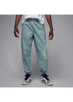 Męskie spodnie do rozgrzewki Jordan Sport JAM - Szary ze sklepu Nike poland w kategorii Spodnie męskie - zdjęcie 184669775