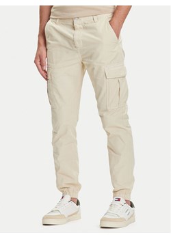 Tommy Jeans Joggery Austin DM0DM21791 Beżowy Slim Fit ze sklepu MODIVO w kategorii Spodnie męskie - zdjęcie 184672798