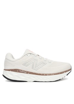 New Balance Buty do biegania Evoz WEVOZRE4 Beżowy ze sklepu MODIVO w kategorii Buty sportowe damskie - zdjęcie 184686785
