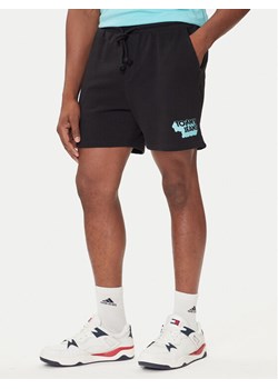 Tommy Jeans Szorty sportowe Stack Logo DM0DM21803 Czarny Relaxed Fit ze sklepu MODIVO w kategorii Spodenki męskie - zdjęcie 184686808