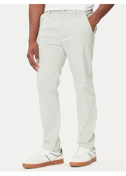 Tommy Jeans Chinosy Austin DM0DM20282 Zielony Slim Fit ze sklepu MODIVO w kategorii Spodnie męskie - zdjęcie 184686816