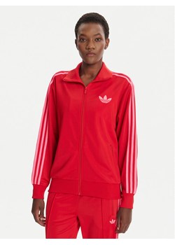 adidas Bluza adicolor Classic Firebird JW3665 Czerwony Loose Fit ze sklepu MODIVO w kategorii Bluzy damskie - zdjęcie 184706796
