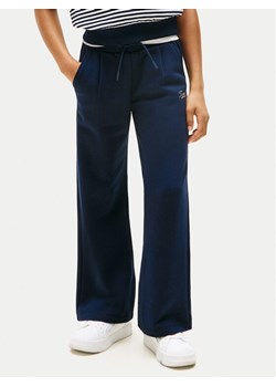 Tommy Hilfiger Spodnie dresowe Script KG0KG08669 Granatowy Wide Leg ze sklepu MODIVO w kategorii Spodnie chłopięce - zdjęcie 184725667