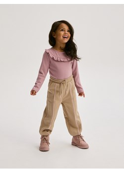 Reserved - Spodnie dresowe z przeszyciami - beżowy ze sklepu Reserved w kategorii Spodnie dziewczęce - zdjęcie 184728038