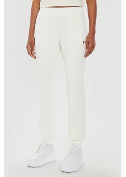 GUESS Beżowe damskie spodnie dresowe Olympe, Rozmiar S ze sklepu outfit.pl w kategorii Spodnie damskie - zdjęcie 184734237