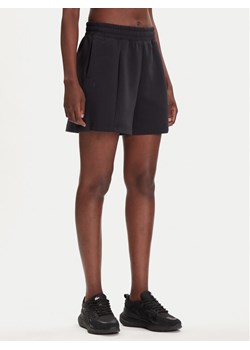 Under Armour Szorty sportowe Unstoppable Flc Pltd Short 1382764-001 Czarny Loose Fit ze sklepu MODIVO w kategorii Szorty - zdjęcie 184738839