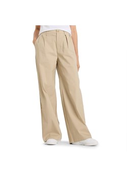 Spodnie damskie New Balance WP51538SOT - beżowe ze sklepu streetstyle24.pl w kategorii Spodnie damskie - zdjęcie 184745529