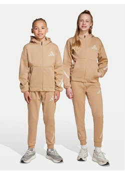 adidas Spodnie dresowe Z.N.E. JW4002 Beżowy Tapered Leg ze sklepu MODIVO w kategorii Spodnie chłopięce - zdjęcie 184769867