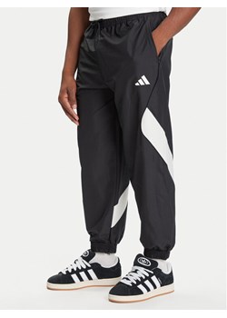 adidas Spodnie dresowe Stadium JN1830 Czarny Loose Fit ze sklepu MODIVO w kategorii Spodnie męskie - zdjęcie 184790325