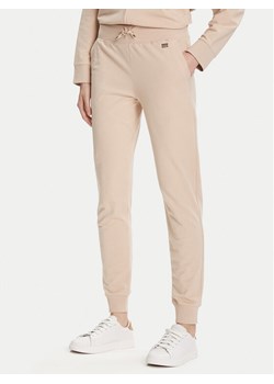 EA7 Emporio Armani Spodnie dresowe 7W000461 AF13135 U1046 Beżowy Regular Fit ze sklepu MODIVO w kategorii Spodnie damskie - zdjęcie 184794197