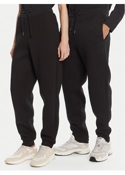 AMI PARIS Spodnie dresowe UTR237.749 Czarny Relaxed Fit ze sklepu MODIVO w kategorii Spodnie damskie - zdjęcie 184820055