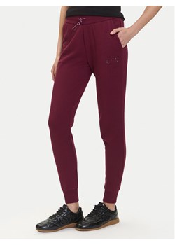 Armani Exchange Spodnie dresowe XW000986 AF16114 UA343 Bordowy Relaxed Fit ze sklepu MODIVO w kategorii Spodnie damskie - zdjęcie 184869639