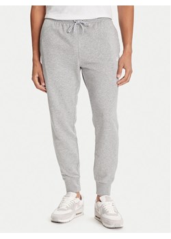 Nike Spodnie dresowe Club Fleece FN3801 Szary Regular Fit ze sklepu MODIVO w kategorii Spodnie męskie - zdjęcie 184884416