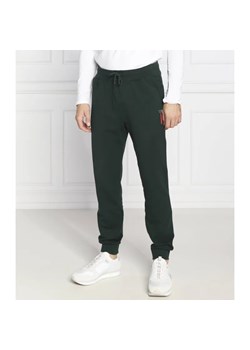 GUESS Spodnie dresowe Adam | Regular Fit ze sklepu Gomez Fashion Store w kategorii Spodnie męskie - zdjęcie 185008105
