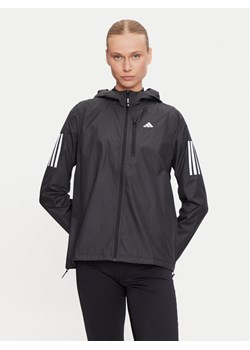 adidas Kurtka do biegania Own The Run IN1576 Czarny Regular Fit ze sklepu MODIVO w kategorii Kurtki damskie - zdjęcie 185030858