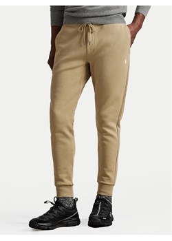 Polo Ralph Lauren Spodnie dresowe 710881518082 Beżowy Regular Fit ze sklepu MODIVO w kategorii Spodnie męskie - zdjęcie 185034897