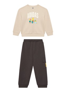 adidas Dres The Simpsons JL9197 Beżowy Regular Fit ze sklepu MODIVO w kategorii Komplety niemowlęce - zdjęcie 185051367