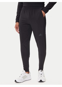 adidas Spodnie dresowe Designed for Training Hybrid IY1123 Czarny Slim Fit ze sklepu MODIVO w kategorii Spodnie męskie - zdjęcie 185391527