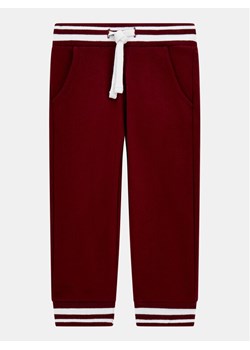Guess Spodnie dresowe N5YQ1 K0170 Bordowy Regular Fit ze sklepu MODIVO w kategorii Spodnie i półśpiochy - zdjęcie 185426599