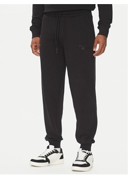 Richmond X Spodnie dresowe UMP25008PA Czarny Regular Fit ze sklepu MODIVO w kategorii Spodnie męskie - zdjęcie 185473459