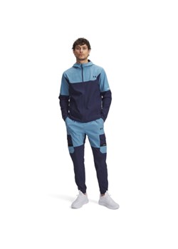 Męskie spodnie treningowe Under Armour UA Tech Utility Woven - niebieskie ze sklepu Sportstylestory.com w kategorii Spodnie męskie - zdjęcie 185482809
