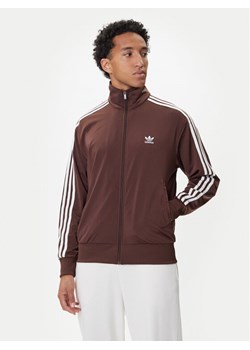 adidas Bluza adicolor Classics Firebird KA0459 Brązowy Loose Fit ze sklepu MODIVO w kategorii Bluzy męskie - zdjęcie 185486828