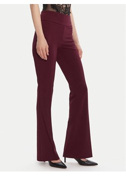 Rinascimento Spodnie materiałowe CFC0125318003 Bordowy Flare Fit ze sklepu MODIVO w kategorii Spodnie damskie - zdjęcie 185486927