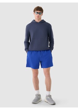 Męskie spodenki casual 4F 4FWSS25TSHOM533  - niebieskie ze sklepu Sportstylestory.com w kategorii Spodenki męskie - zdjęcie 185641407