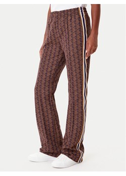 Lacoste Spodnie dresowe XF9313 Brązowy Regular Fit ze sklepu MODIVO w kategorii Spodnie damskie - zdjęcie 185653896
