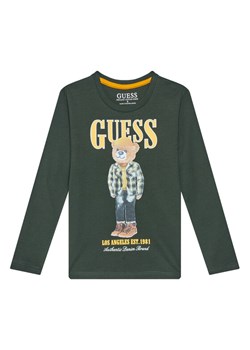 Guess Bluzka N5BI04I3Z14 Zielony Regular Fit ze sklepu MODIVO w kategorii T-shirty chłopięce - zdjęcie 185679305