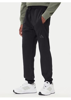 adidas Spodnie dresowe ALL SZN Fleece IX1246 Czarny Tapered Leg ze sklepu MODIVO w kategorii Spodnie męskie - zdjęcie 185724097
