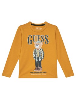 Guess Bluzka N5BI04 I3Z14 Żółty Regular Fit ze sklepu MODIVO w kategorii T-shirty chłopięce - zdjęcie 185737488