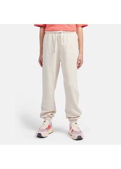 Spodnie dziecięce New Balance LAKG0058LIN – beżowe ze sklepu New Balance Poland w kategorii Spodnie chłopięce - zdjęcie 185753299