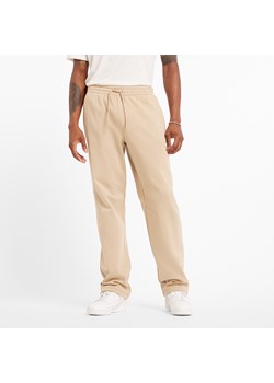 Spodnie męskie New Balance MP44587SNW – beżowe ze sklepu New Balance Poland w kategorii Spodnie męskie - zdjęcie 185753856
