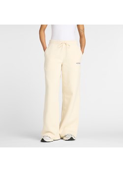 Spodnie damskie New Balance WP53903LIN – beżowe ze sklepu New Balance Poland w kategorii Spodnie damskie - zdjęcie 185754089