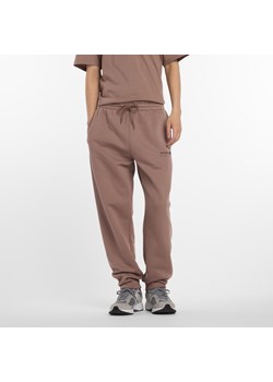 Spodnie męskie New Balance MP53508EAS – brązowe ze sklepu New Balance Poland w kategorii Spodnie męskie - zdjęcie 185754109