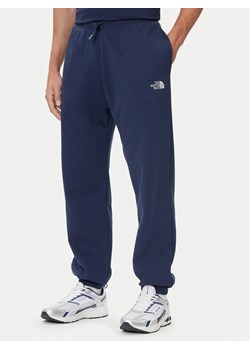 The North Face Spodnie dresowe Essential NF0A8C1F Granatowy Relaxed Fit ze sklepu MODIVO w kategorii Spodnie męskie - zdjęcie 185792995