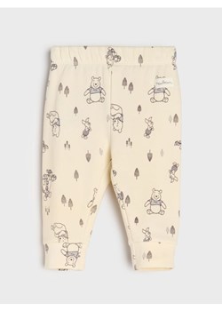 Sinsay - Spodnie z polarem w środku Winnie the Pooh - kremowy ze sklepu Sinsay w kategorii Odzież dla niemowląt - zdjęcie 185803999