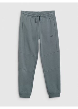Chłopięce spodnie dresowe joggery 4F 4FJRAW25TTROM1578 - turkusowe ze sklepu Sportstylestory.com w kategorii Spodnie chłopięce - zdjęcie 185837316