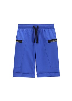 Coccodrillo Szorty sportowe WC5120501IBJ Niebieski Regular Fit ze sklepu MODIVO w kategorii Spodenki chłopięce - zdjęcie 185868517