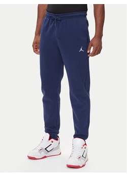 Nike Spodnie dresowe FV7277 410 Granatowy Regular Fit ze sklepu MODIVO w kategorii Spodnie męskie - zdjęcie 185868876