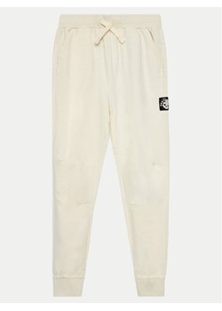 Coccodrillo Spodnie dresowe WC4120104CEJ Écru Regular Fit ze sklepu MODIVO w kategorii Spodnie dziewczęce - zdjęcie 185869198