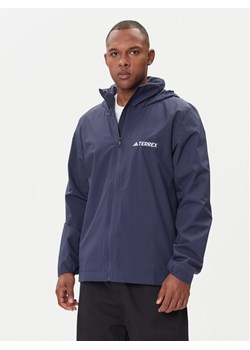 adidas Kurtka przeciwdeszczowa Multi Essentials 2L Rain JY0477 Pomarańczowy Regular Fit ze sklepu MODIVO w kategorii Kurtki męskie - zdjęcie 185870675