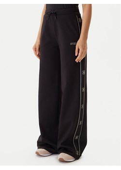 Guess Spodnie dresowe V5BB12 KCX22 Czarny Wide Leg ze sklepu MODIVO w kategorii Spodnie damskie - zdjęcie 186030279