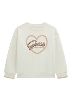 Guess Bluza K5BQ05 KAV34 Écru Relaxed Fit ze sklepu MODIVO w kategorii Bluzy dziewczęce - zdjęcie 186031946