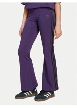 adidas Legginsy adicolor JV8618 Fioletowy Slim Fit ze sklepu MODIVO w kategorii Spodnie dziewczęce - zdjęcie 186031958
