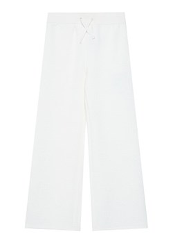 Guess Spodnie dresowe J5BQ11 K0742 Écru Wide Leg ze sklepu MODIVO w kategorii Spodnie dziewczęce - zdjęcie 186032606